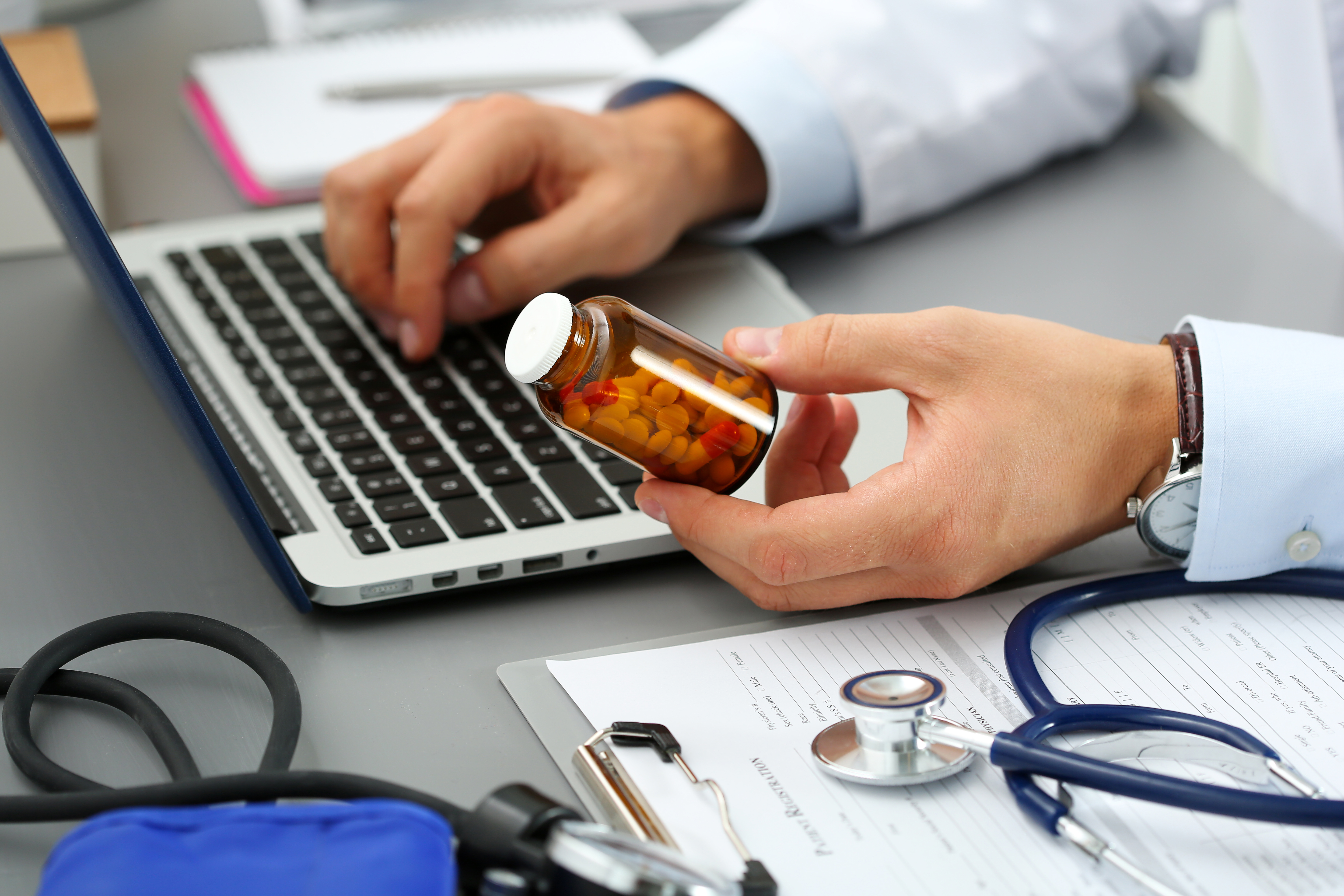 AllianceRx_Banner.jpg (Male medicine doctor hands hold jar of pills)